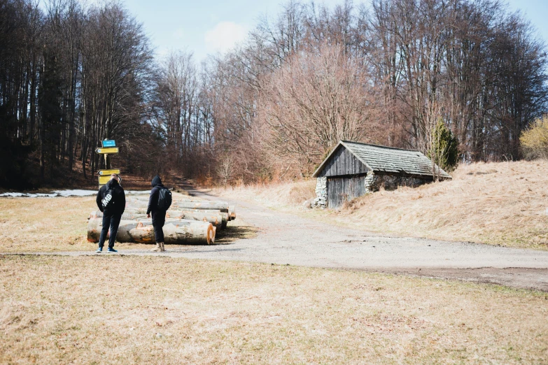 two people standing in the middle of an open area