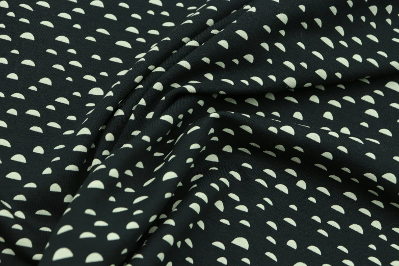 black and white patterned fabric with hearts on it