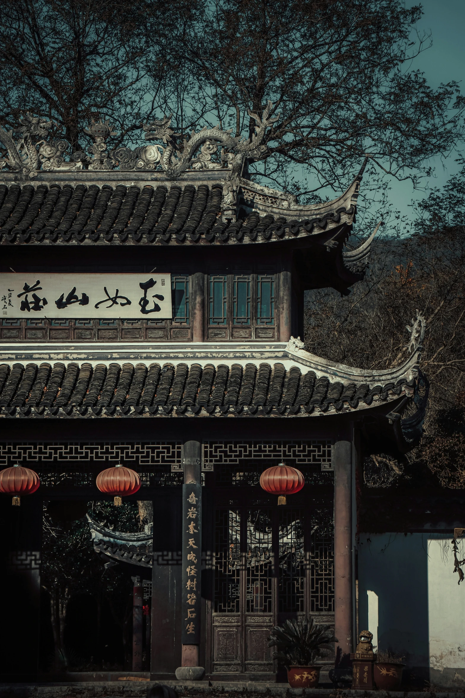 an oriental style building with trees around it