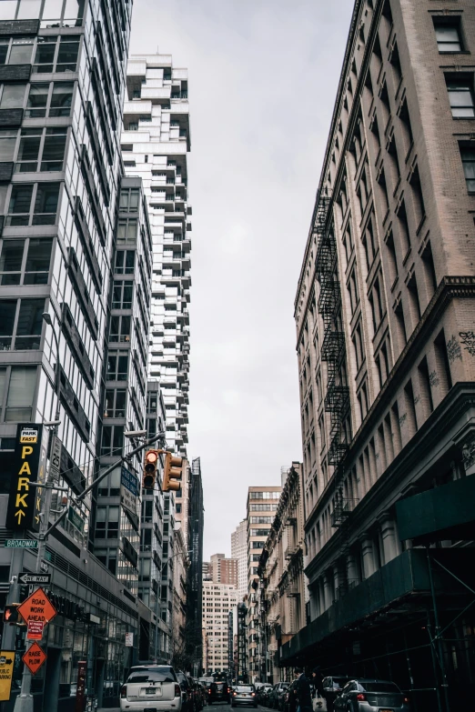 a street view from the sidewalk with various building type structures