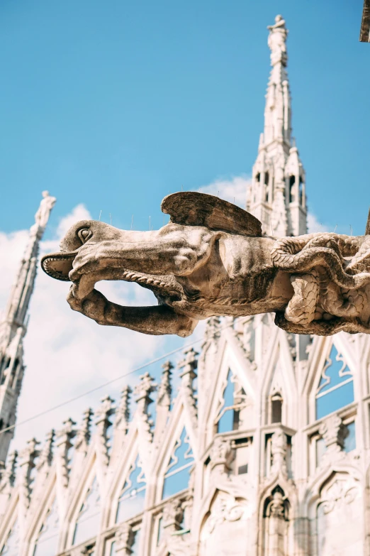 the architecture of a cathedral has carved figures