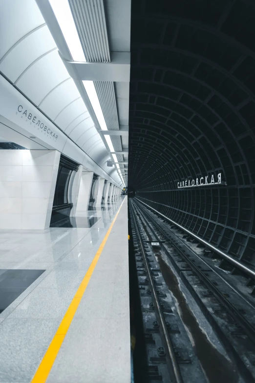 a train track leading into a tunnel