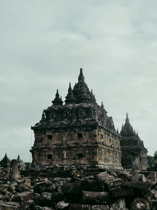 a very tall building with many spires next to it