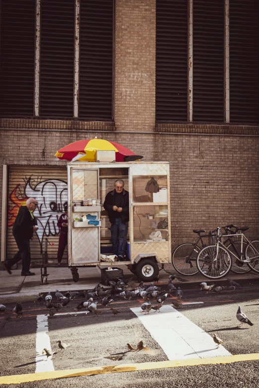 two people standing in an outdoor ice cream shop