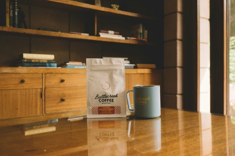 a bag and coffee mug on a table