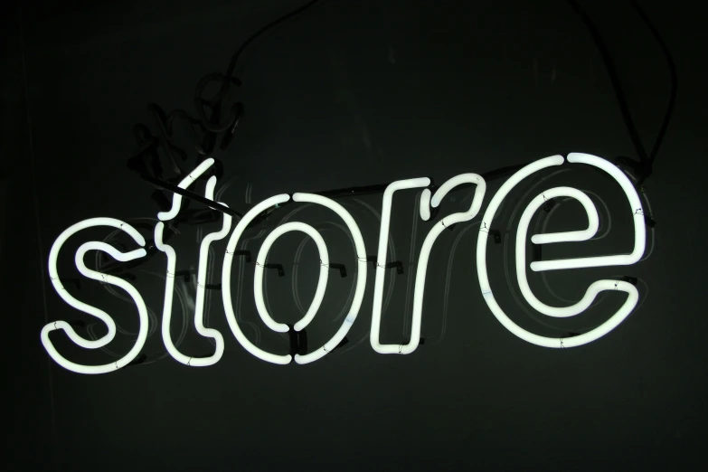 the word store written in neon lights