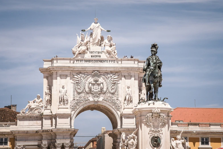 the monument in front of the building with a statue on it