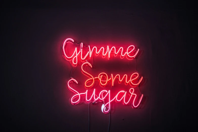 a neon sign reads, gym some sugar