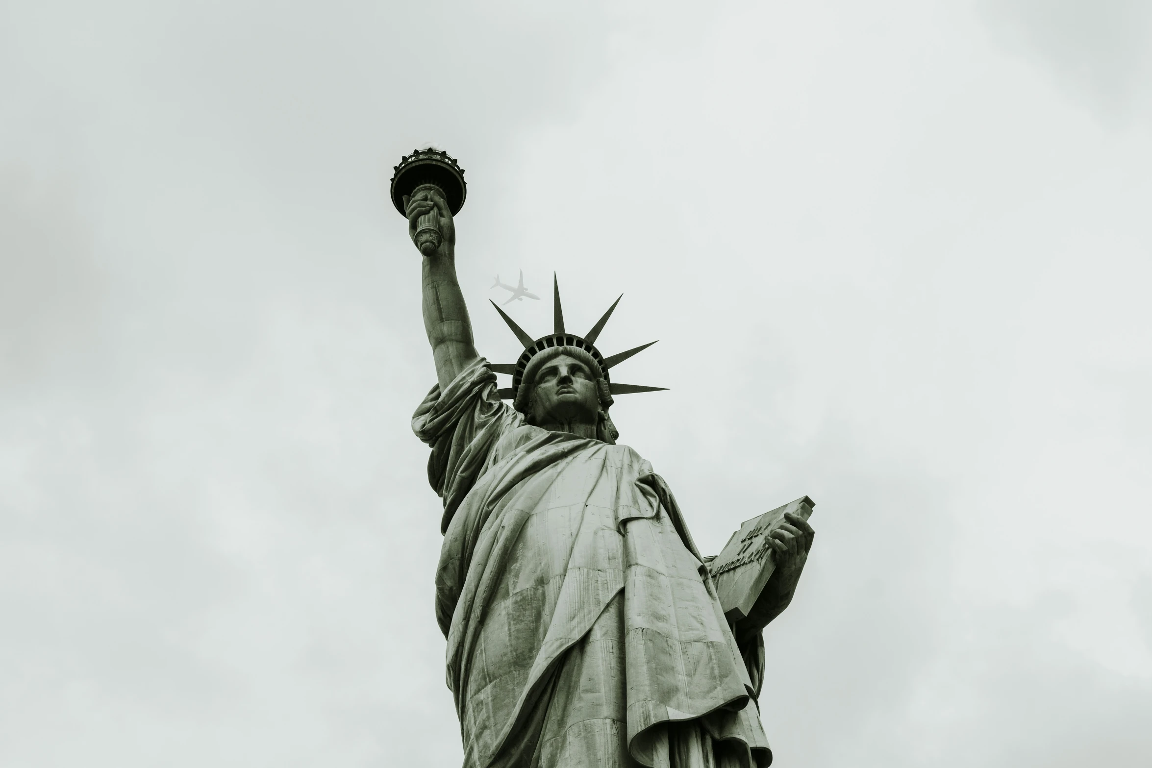 a picture of the statue of liberty that is part of a city