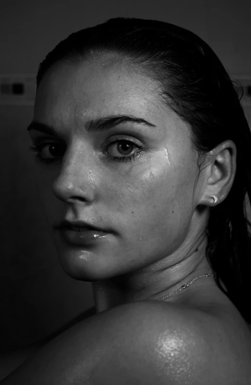 a woman in the shower with very thick hair