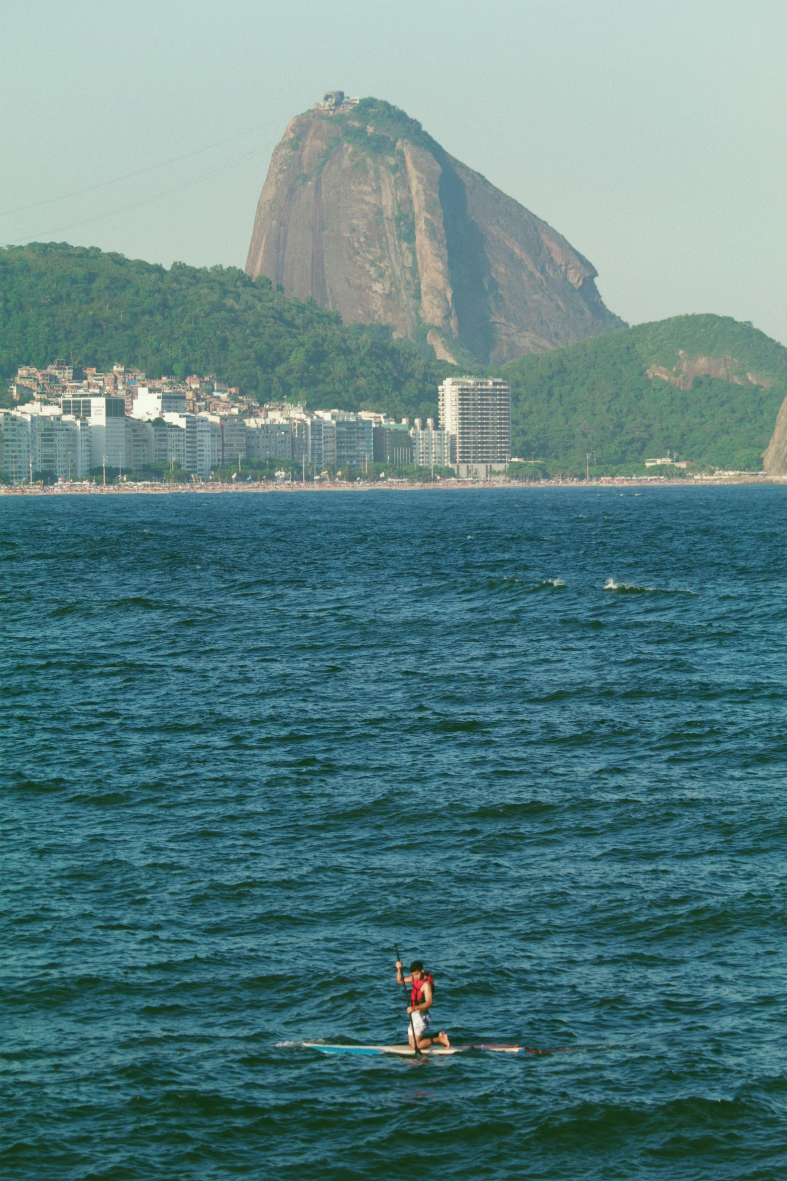 a person in the water on a surfboard