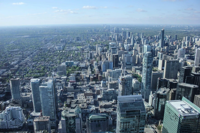 a city skyline from the air with blue sky in background