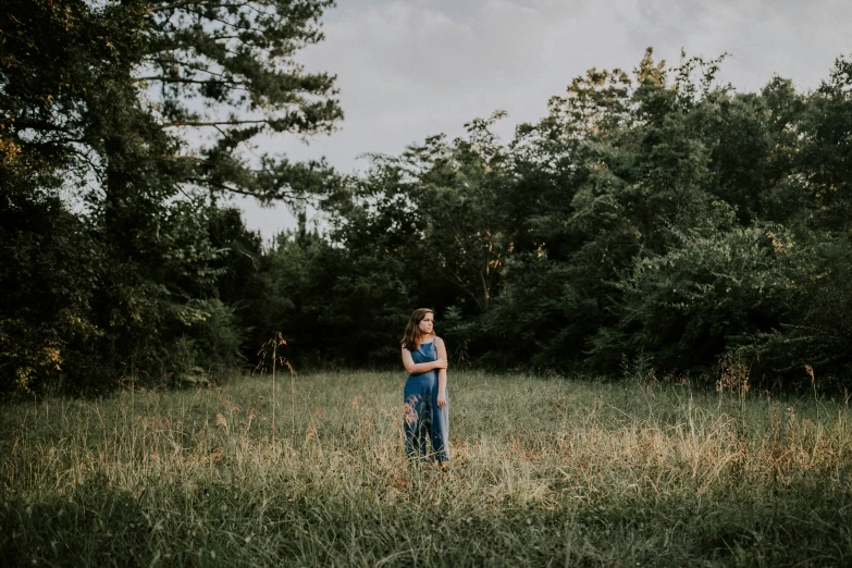 an individual in a field full of trees