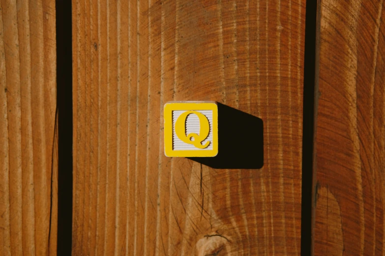 this is a closeup picture of a wooden door with stickers on it