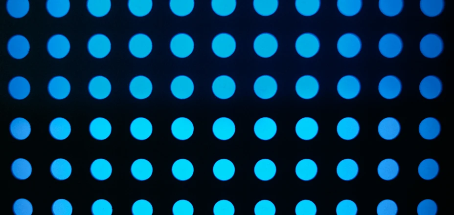 a blue display of different sizes on a black surface