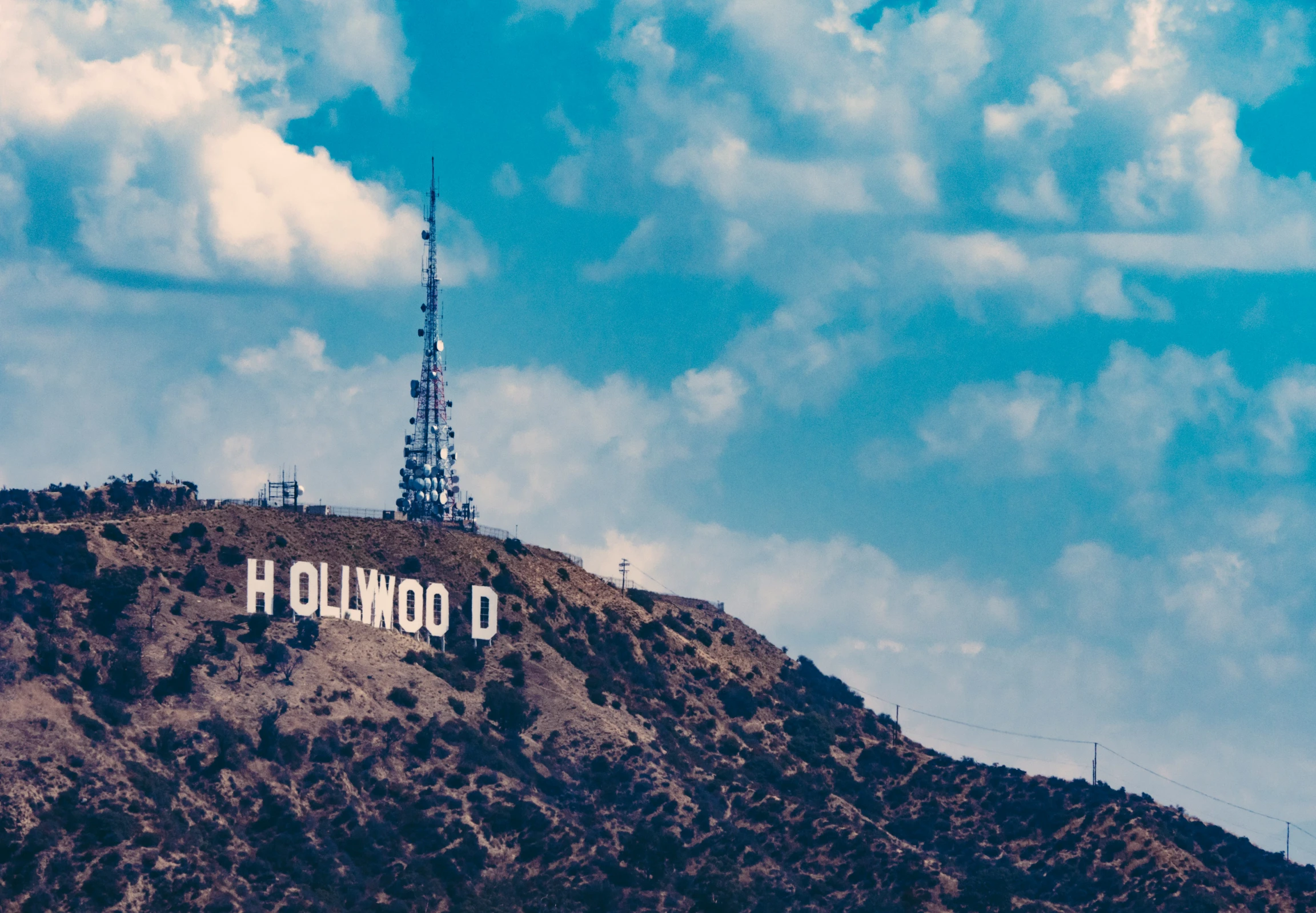 the hollywood sign, located on a hill