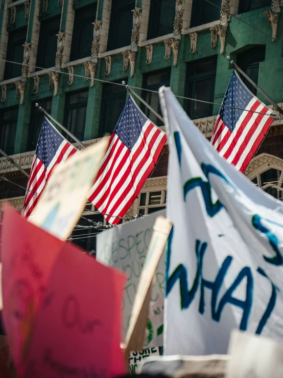 american flags are flown from wires, with the word obama above them