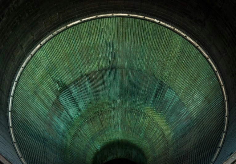 a green and black po of a tunnel