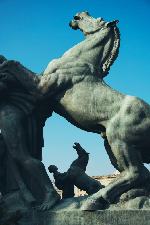 a statue of a horse rearing it's hind legs