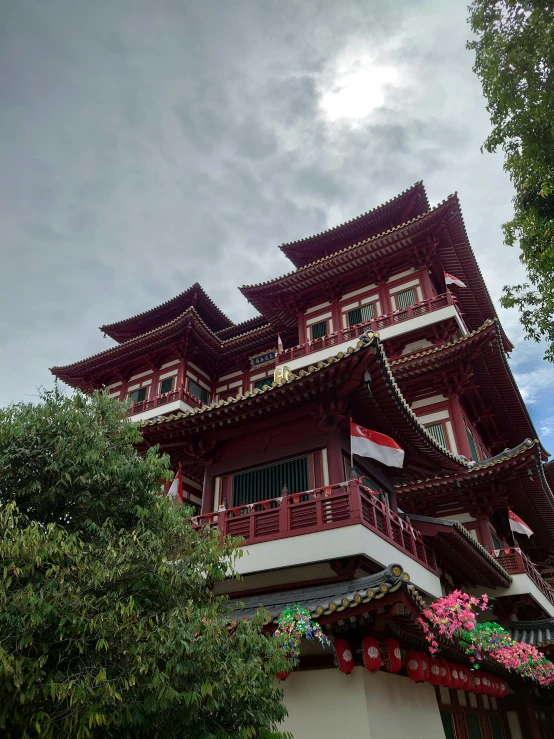 tall oriental building with red and white colors