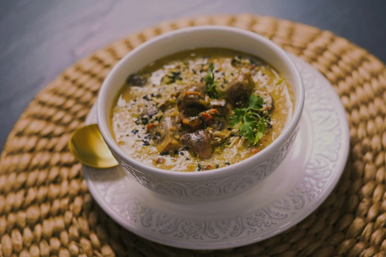 bowl filled with food sitting on top of a woven table cloth