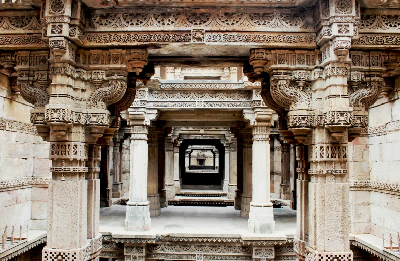 an elaborate doorway with carved pillars and arches