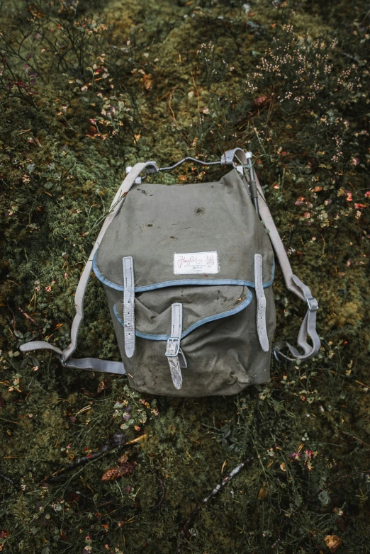 a backpack that is lying on the ground