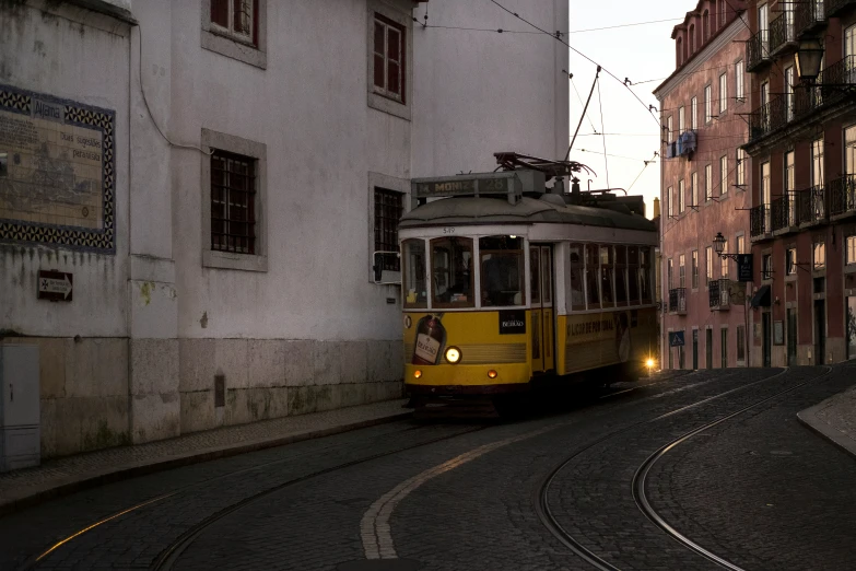 a trolley is driving through a small street