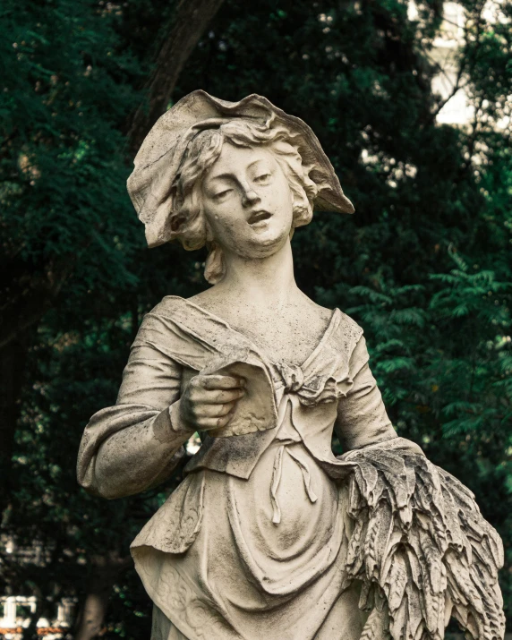 a statue of a woman holding an angel