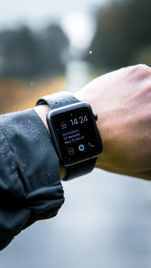 this is an image of a woman displaying a smartwatch