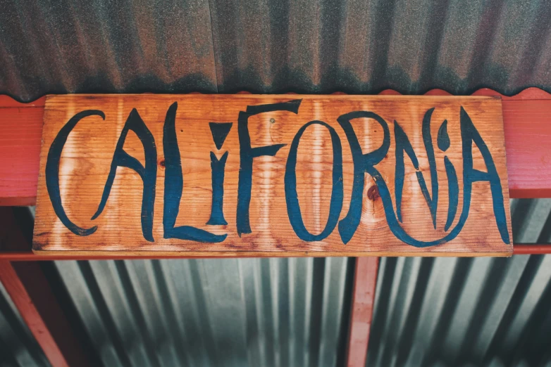 a sign that says california is on the roof of a building