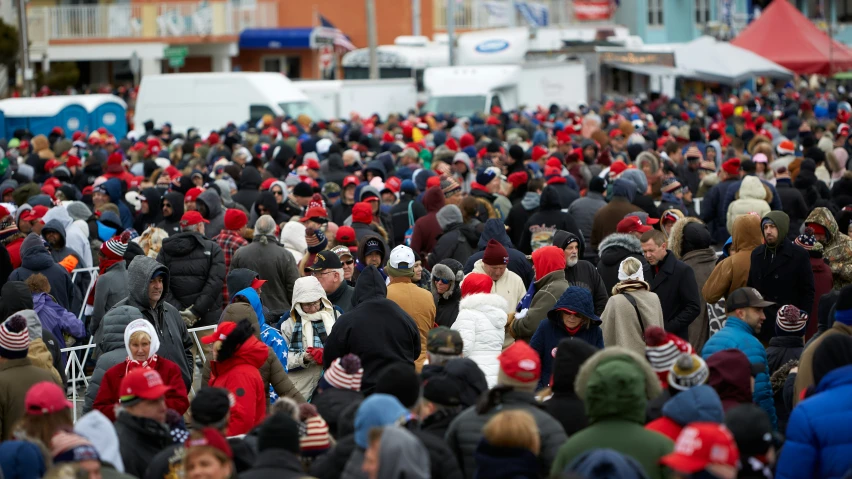 people standing in a crowd at an outdoor event