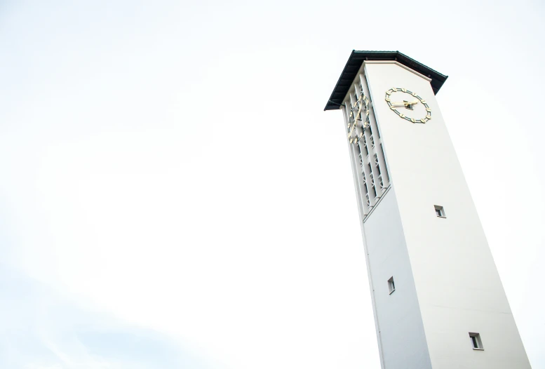 clock tower with metal bars on top that overlooks a city