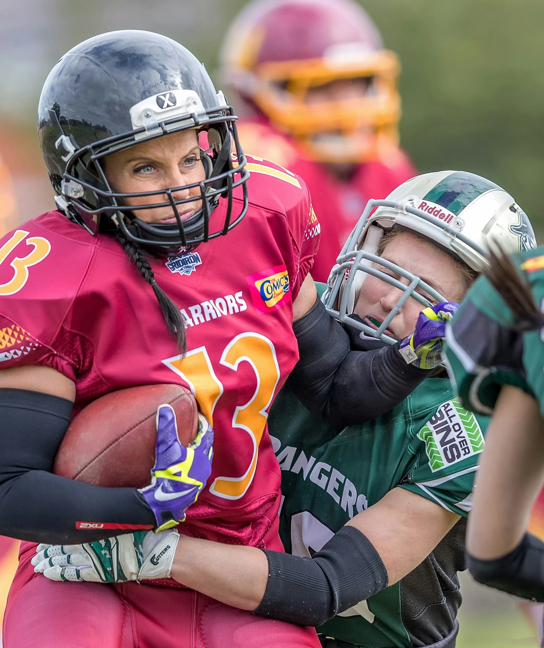 the football players are running with the ball