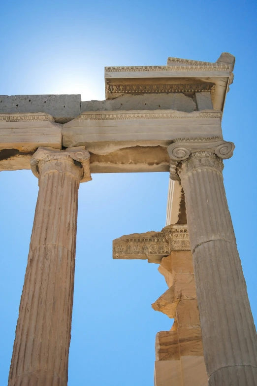 the ancient ruins of an ancient greek town against a blue sky