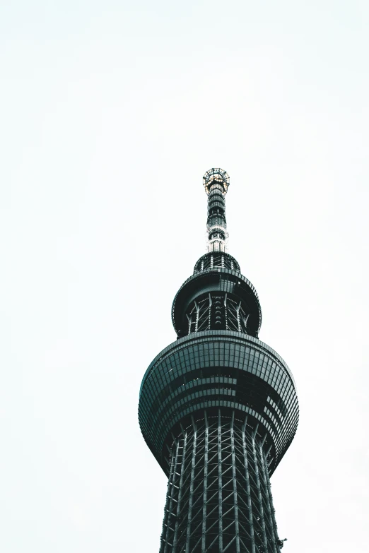 the large tower is black and tall with a metal roof