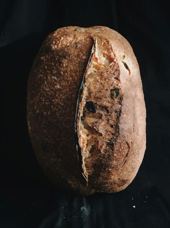 a loaf of bread with a partially eaten crust