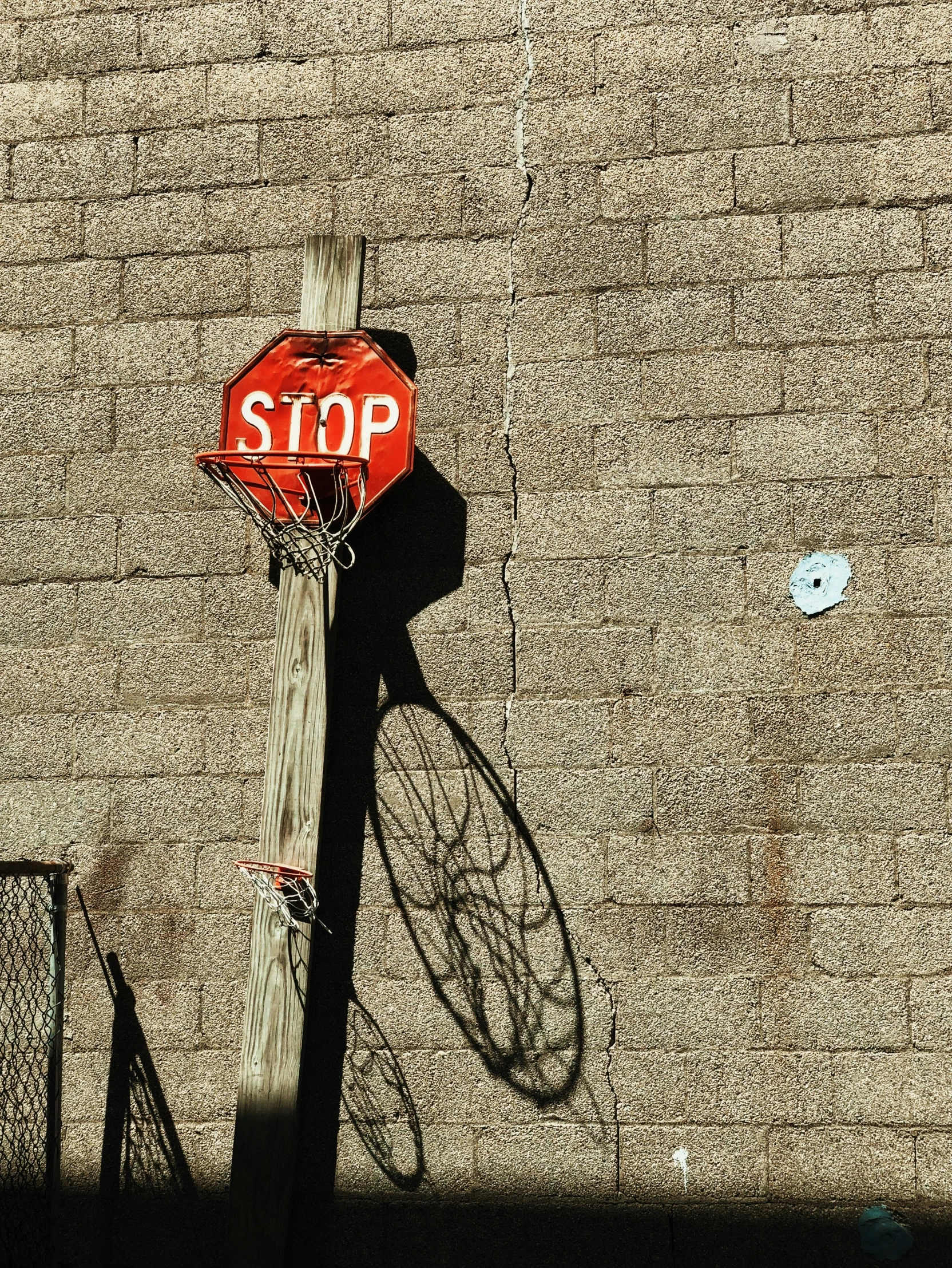 a stop sign with a bicycle leaning against it