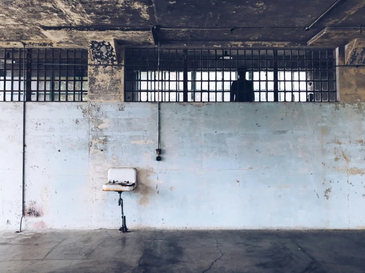 a cell phone sitting on the wall in a building