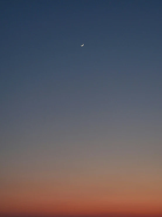 an airplane is seen flying through the night sky