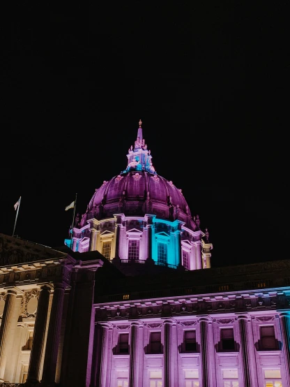 a building lit up in purple and blue lights