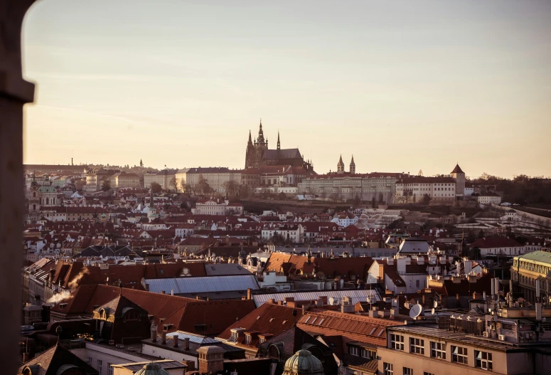 view of old city with church spires during dusk