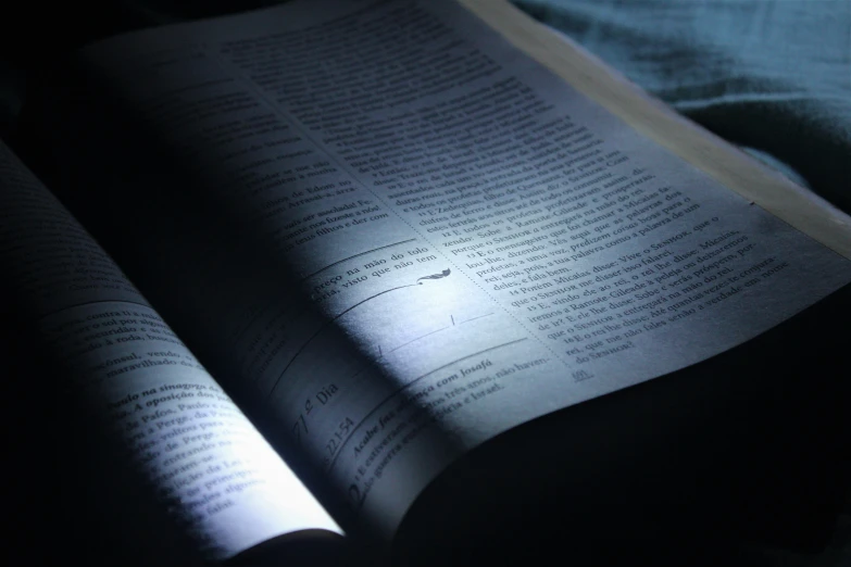 a book is sitting open on a bed