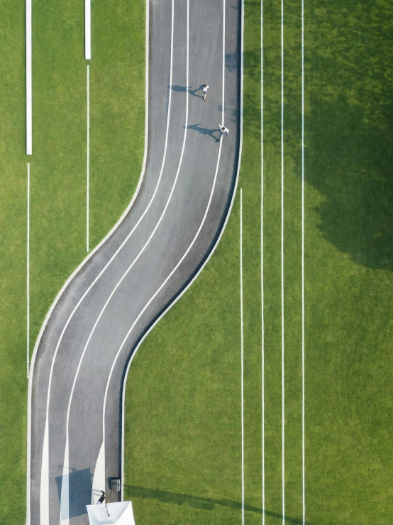 a long winding road is seen from above