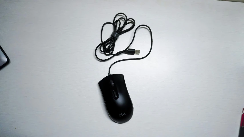 a computer mouse on top of a desk next to some items