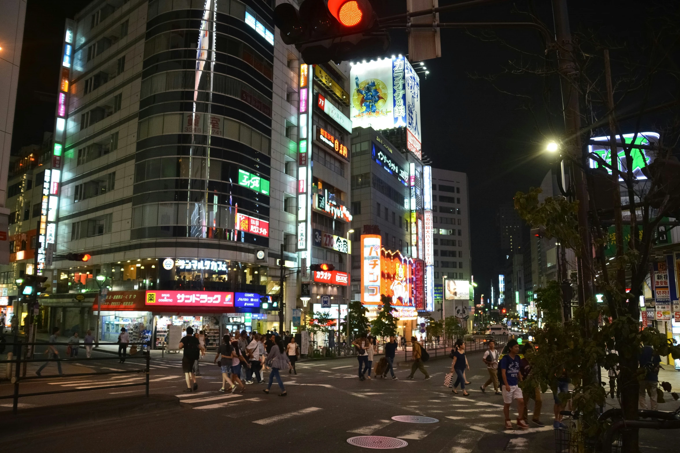 people in a tokyo night street crowded with neon lights