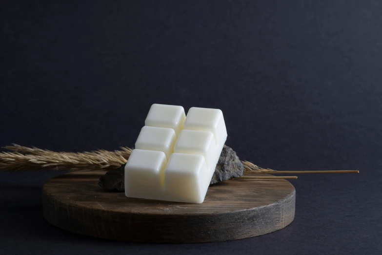 some soap on a stick, with a black background