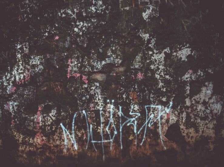 a graffiti - covered wall with the word'washington'written in blue