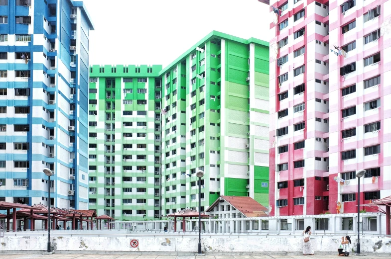 some very colorful buildings against the sky in a city