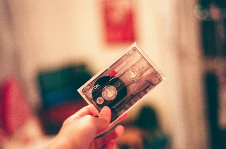 a person holding a cd in their hands